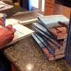 Student to Autograph Books at Oak Lawn Library
